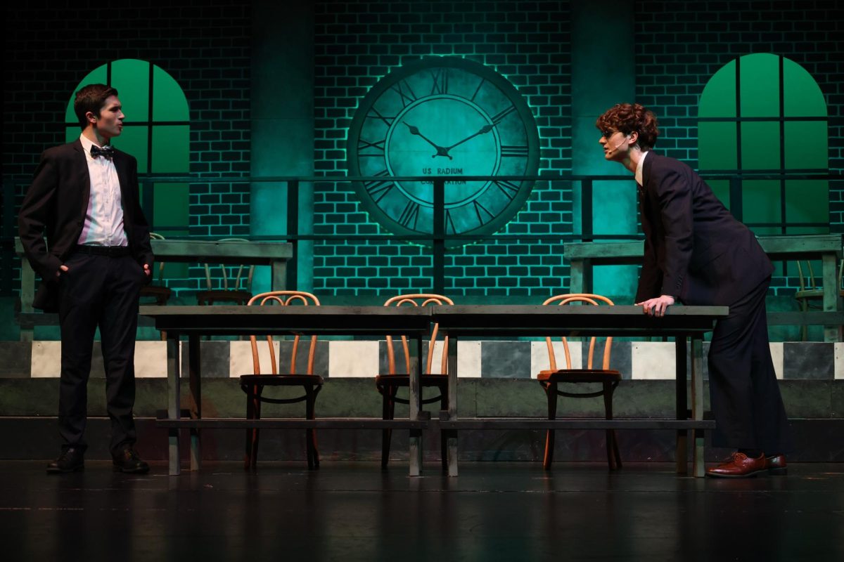 Actors William Lemcio and Hayden Austneberg practice their performance during the dress rehearsal for the play "Radium Girls." 